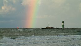 Sunset over Baltic Sea waves in front of Warnemünde
